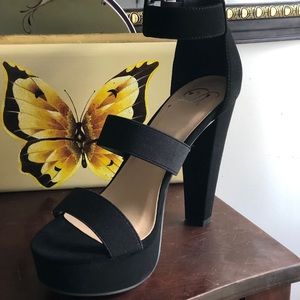 Black platform chunky heels with buckles.